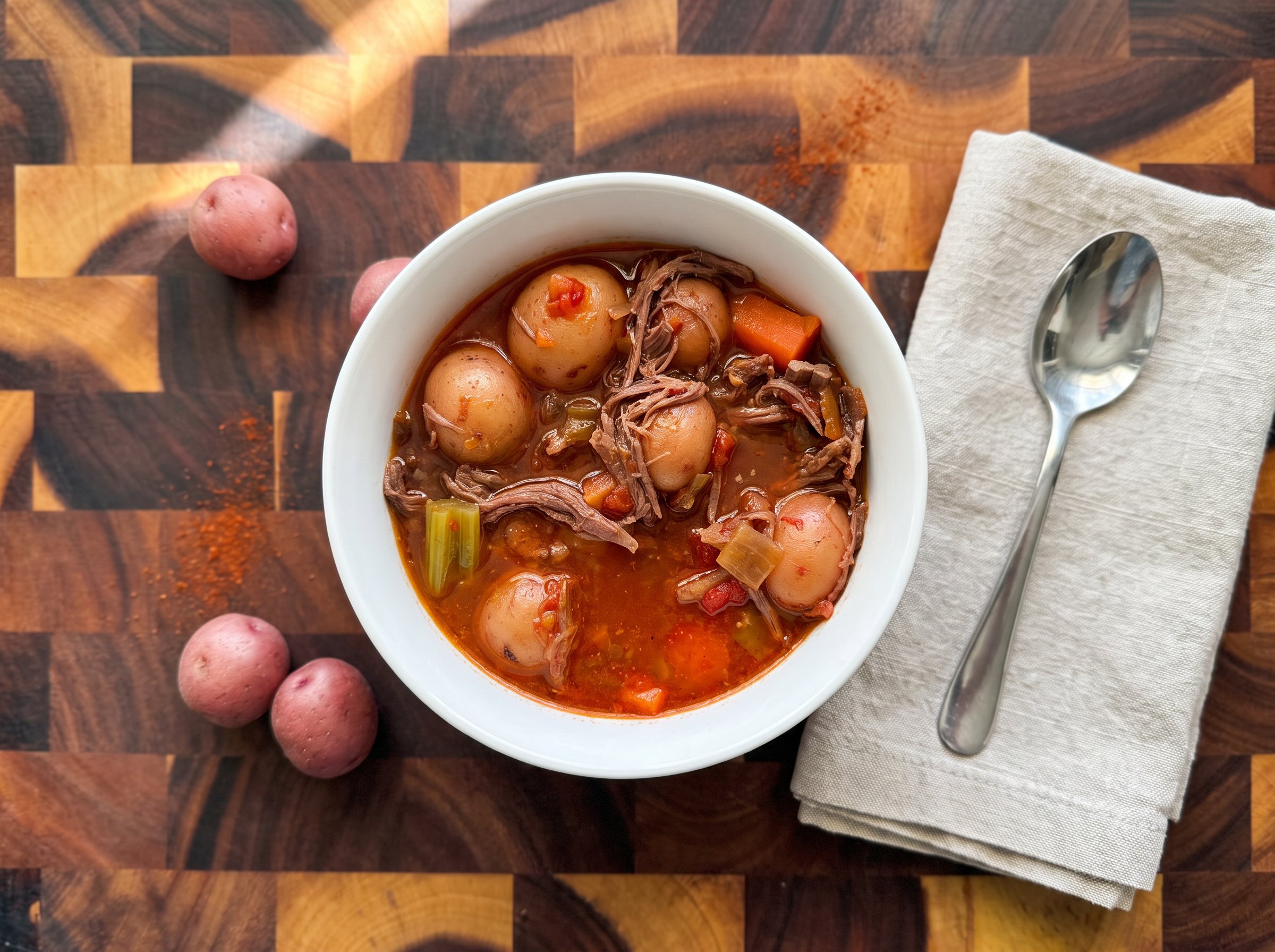 Instant Pot chuck roast in a white bowl, overhead view